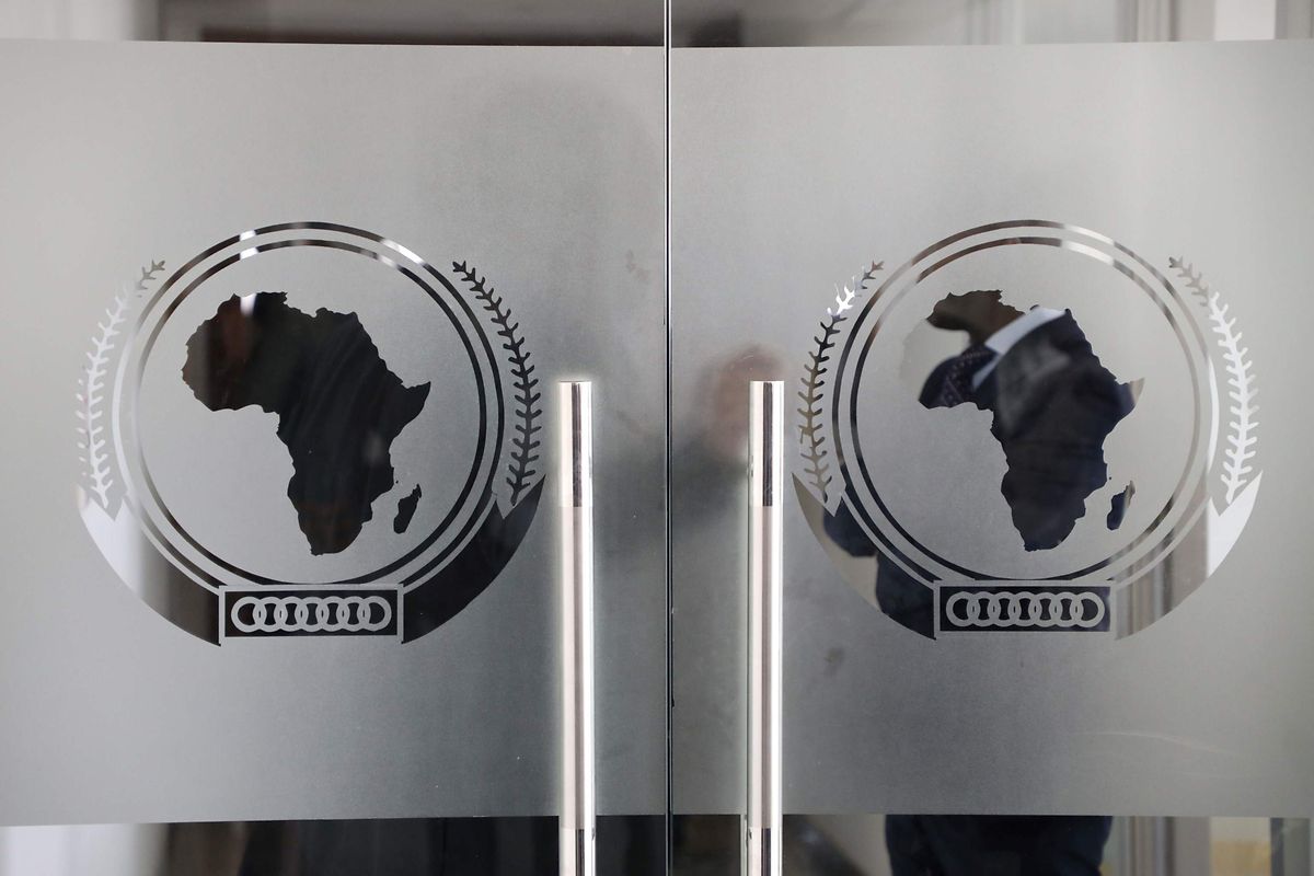 The logo of the African Union (AU) is seen at the entrance of the AU headquarters on March 13, 2019, in Addis Ababa. (Photo by Ludovic MARIN / POOL / AFP)
