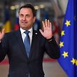Luxembourg's Prime Minister Xavier Bettel reacts as journalists shout upon his arrival at the European Council in Brussels on October 17, 2018. - British Prime Minister Theresa May is due to address a summit of European Union leaders in which Brexit negotiations are expected to be top of the agenda. (Photo by Ben STANSALL / AFP)